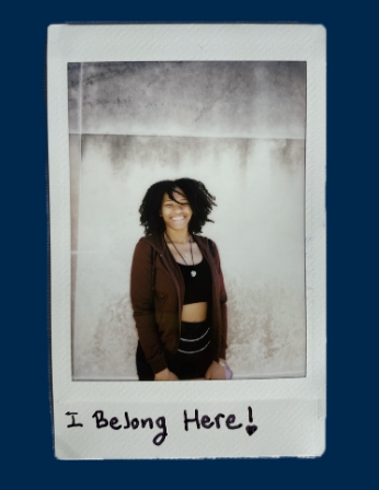 polaroid of young black woman in crop top smiling outside